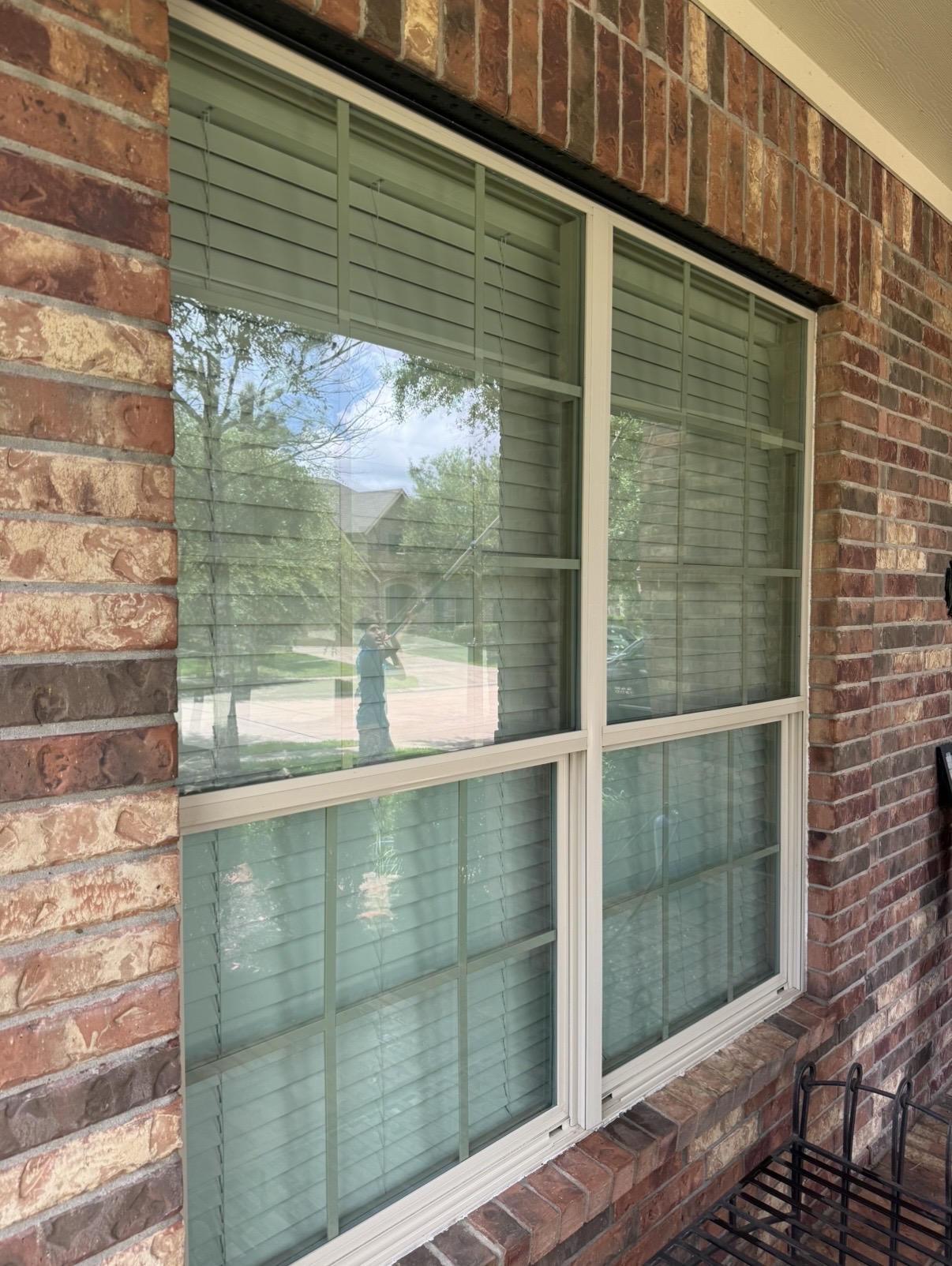 Our reflection in a freshly cleaned customer window