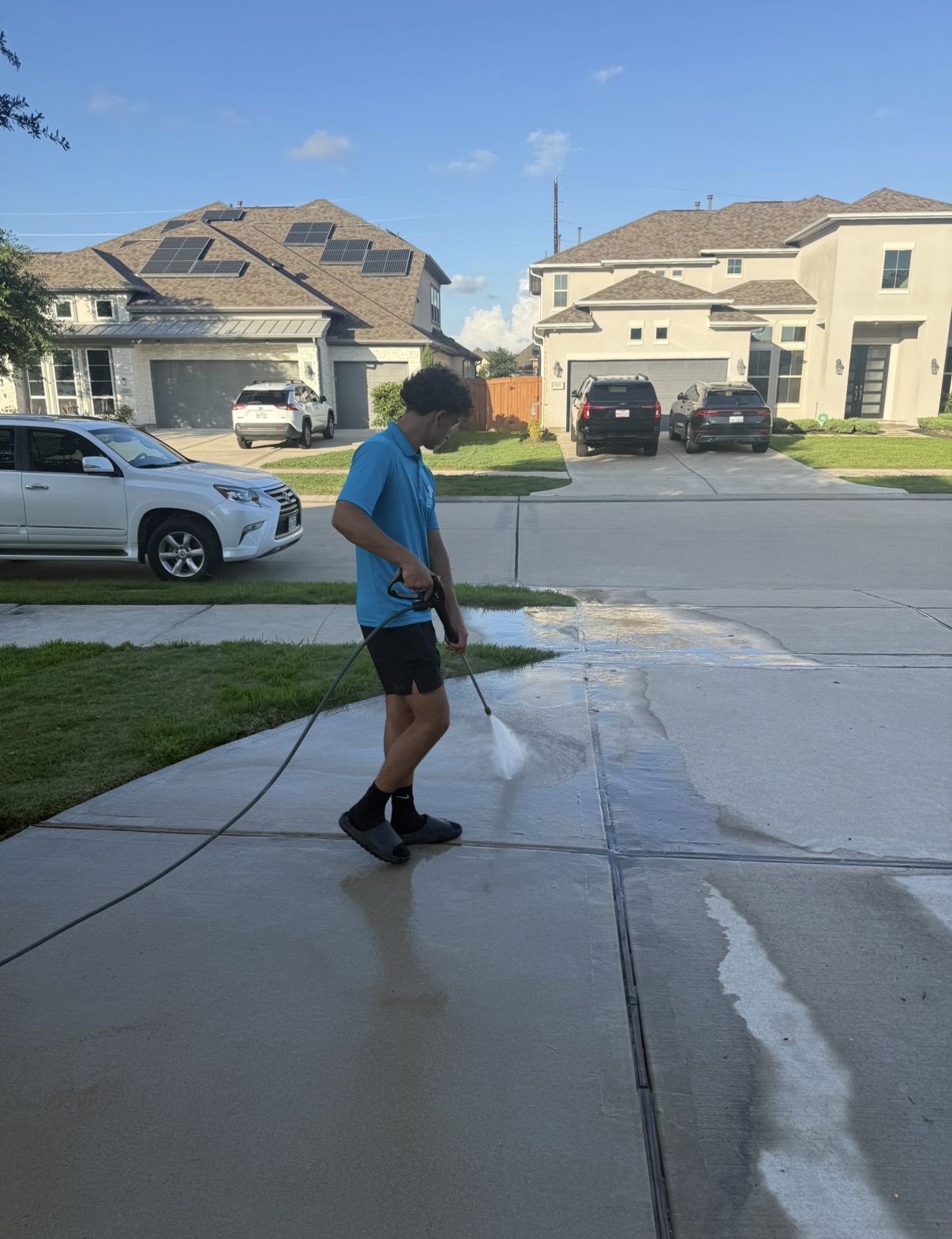 Pressure washing a driveway — Titan in action